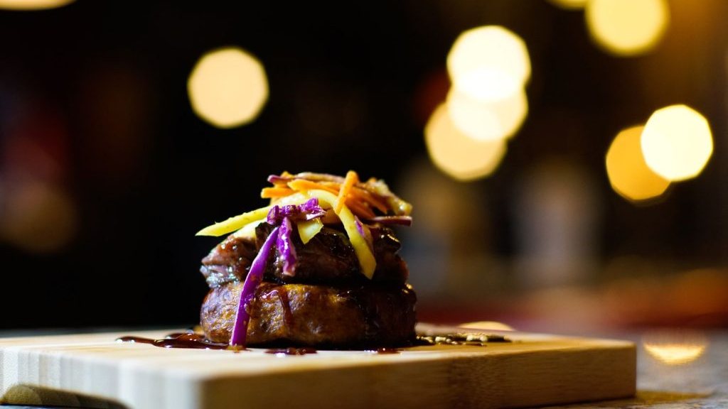 A smoked beef medallion appetizer with slaw at Sugar'd
